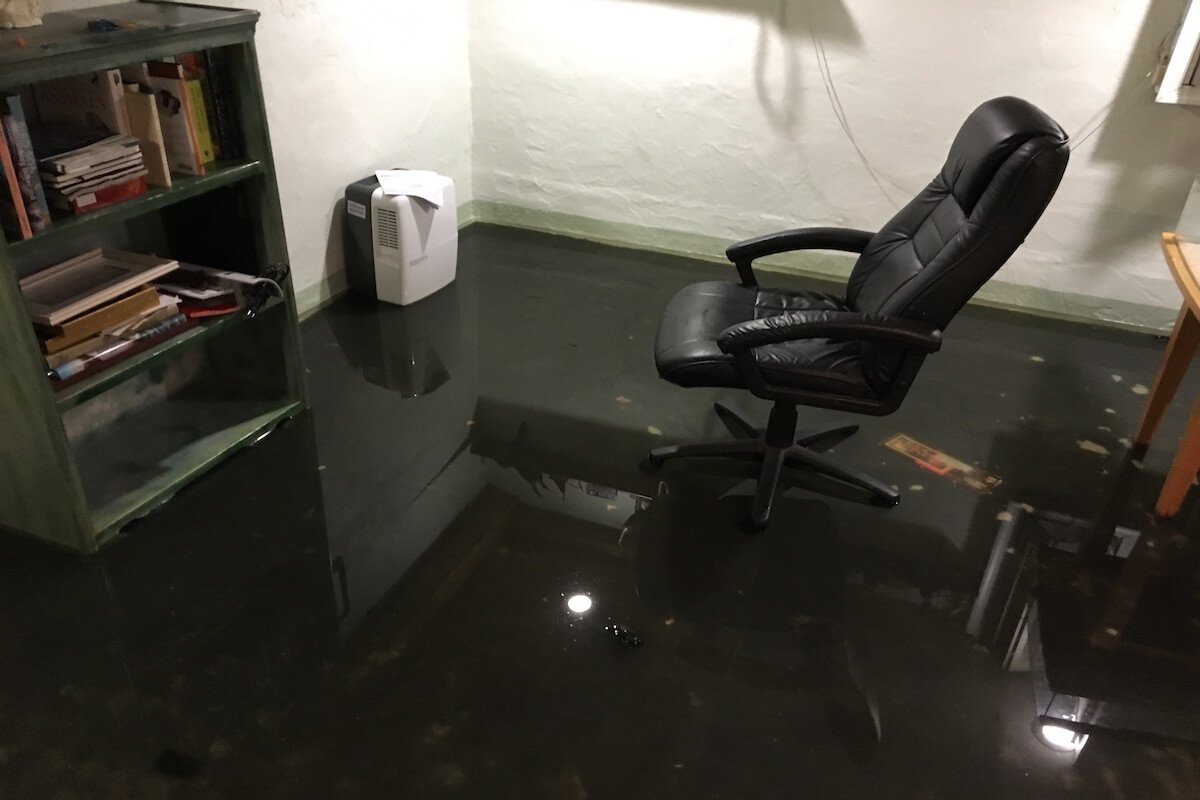 Flooded Virginia Beach basement before professional cleanup — real example used in our water damage restoration cost Hampton Roads guide.